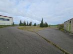 Gr. GS mit Bestand aus Hallen, Garagen, Büros, Sozialräumen (ca. 13.000 m² NF), 89 SP - Parkplatz + Trafohaus